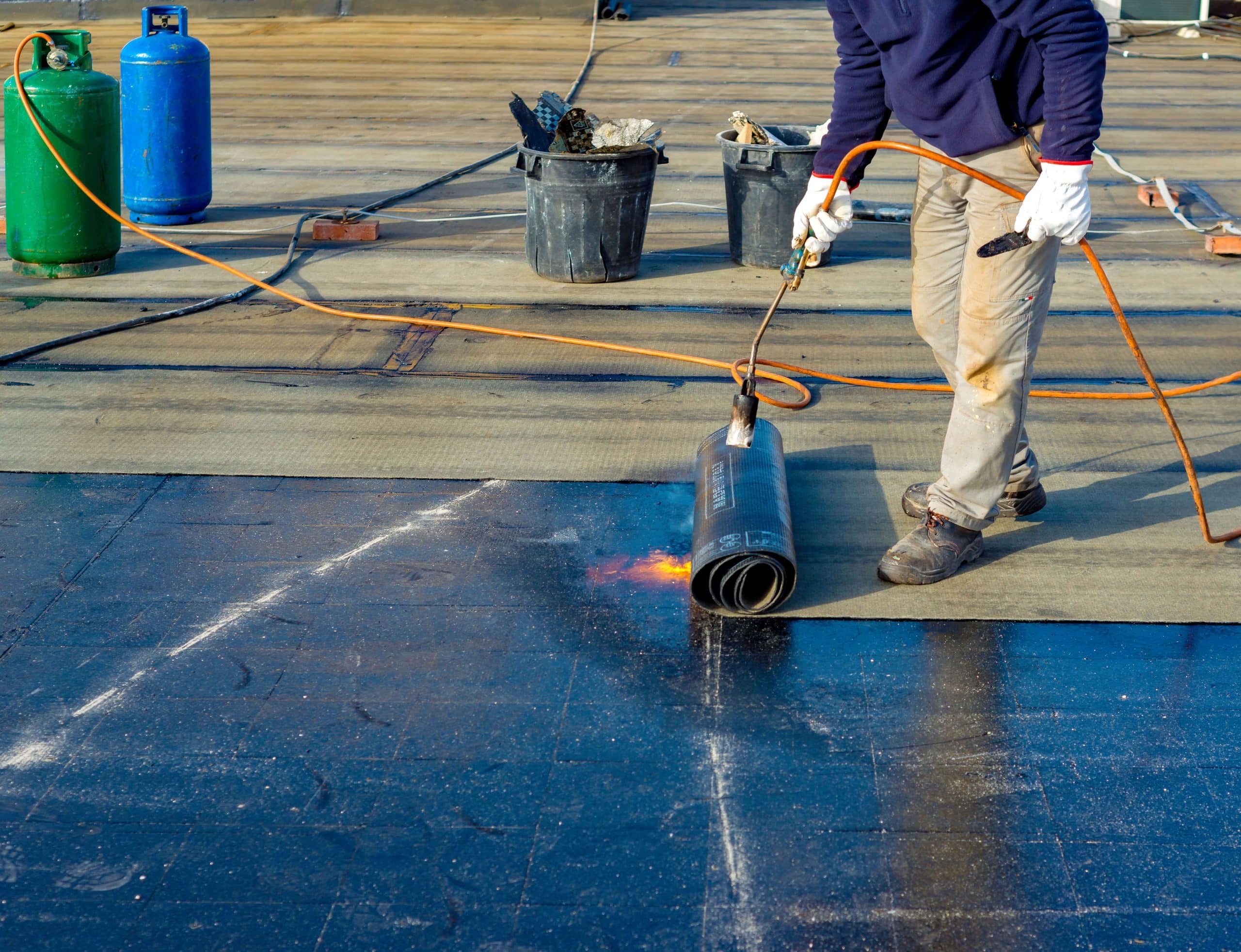 Roof waterproofing service on a flat roof in New York.
